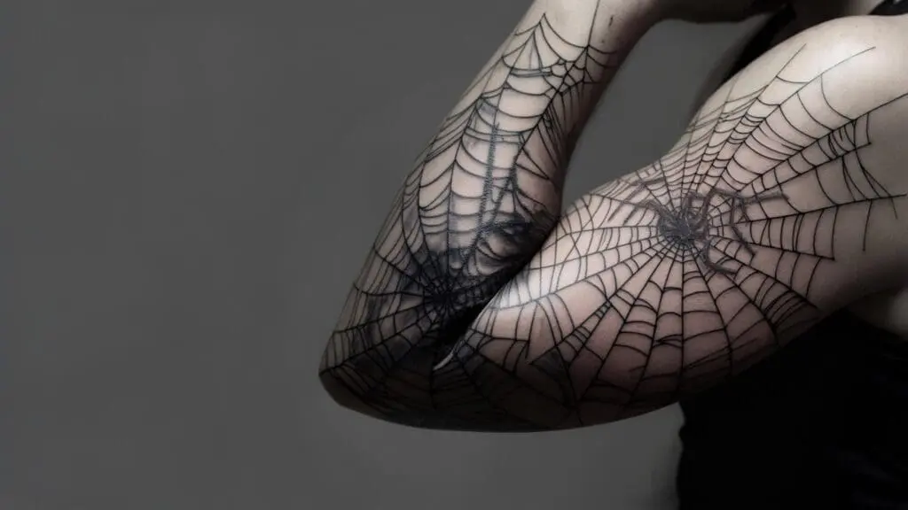 spider web elbow tattoo