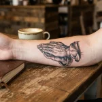 praying hands tattoo